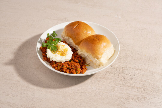 Mutton Kheema Pav OR Indian Spicy Minced Meat served with bread OR kulcha