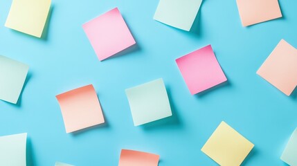 Colorful sticky notes scattered on a blue background, vibrant stationery idea for organizing ideas, reminders, or creative projects, perfect for office or study settings