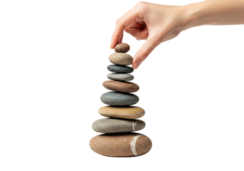 Female hand stacking multicolor stones for balance and relaxation. Cut out PNG