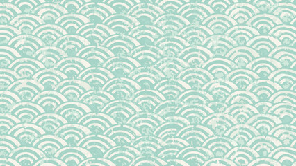 Repeating pattern of white semi circles on a light green background creating a textured wave design look