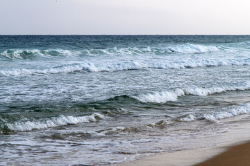 tranquil winter seascape with waves on the beach