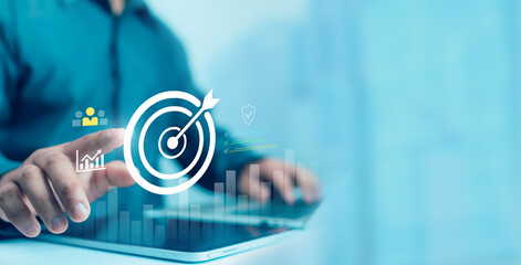 Businessman showing virtual target icon for business purpose, strategic planning for business growth and target customer group. Set business objectives goals, value, growth.	
