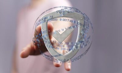Hand holding a digital shield, symbolizing online security and data protection.