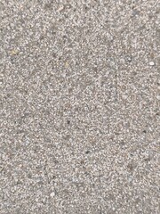 Close-up of fine beach sand texture. Natural neutral background with tiny grains and soft colors. Ideal for travel themes, summer design, nature backdrops, and product presentations.