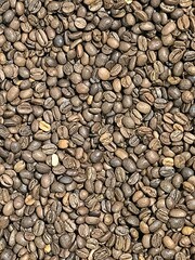 Roasted coffee beans background. High-resolution close-up texture with natural brown shades. Perfect for coffee shop branding, packaging, cafe menus, and food industry visuals.