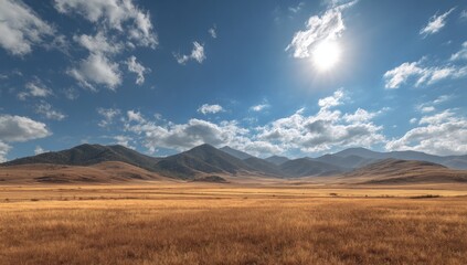 Obraz premium Sunny vista of a golden, dry plain stretching to a mountain range