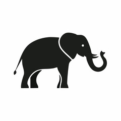 Fototapeta premium A flat black silhouette of an elephant in profile view. An icon of a large mammal with a raised trunk, big ears, and tusks.