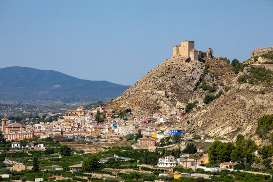 The town of Mula, Murcia Region, Spain, with the medieval castle of Los V&eacute;lez and the orchard at its feet