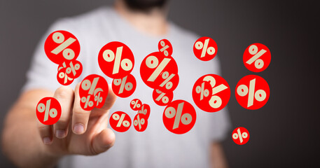 Image of a person interacting with percentage symbols, ideal for finance, discounts, and sales concepts.