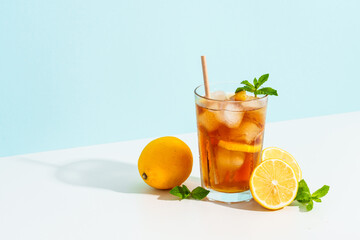 Summer cold drink on colored background with hard shadows.