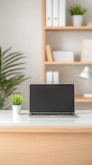Fototapeta premium Modern minimalist workspace with a sleek laptop on a clean white desk