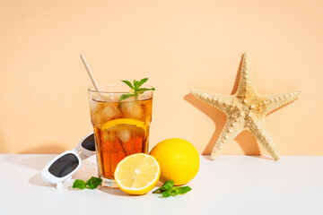 Summer iced cocktail drink with sunglasses and sunny shadows.