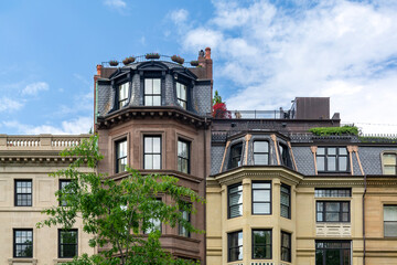Elegant rowhouses with mansard roofs and bay windows on Commonwealth Avenue in Boston, Massachusetts, USA