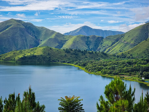 View of Lake Toba and beautiful green hills located in Samosir Regency. Natural view of the lake from the top of the hill. Beautiful nature.
