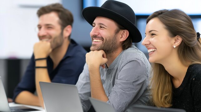 Young creative team laughing in meeting portrait image. Three diverse professionals enjoying discussion photography human scene. Positive office culture concept photo-realistic - Powered by Adobe