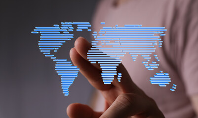 Hand interacting with a digital world map, representing global connectivity and networking.
