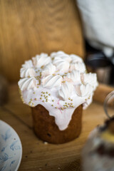Traditional Easter cakes (kulich) with icing, dried fruits, and nuts on rustic background. Homemade sweet bread, festive pastry for Orthodox Easter, decorated with eggs and spring details.