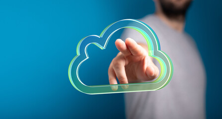 Person interacting with a digital cloud, symbolizing cloud computing, data storage, and network access.