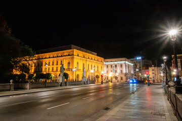 Fototapeta premium Urban cityscape of Burgos at night with illuminated historic buildings, Spain.