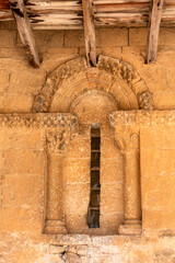 Fototapeta premium Romanesque window on the facade of the Church of San Miguel, Valdenoceda de Valdivieso, Spain