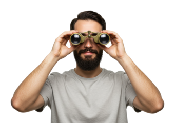Caucasian young male with beard looking through vintage binoculars. Cut out PNG