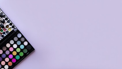 Two makeup palettes, various colors, on a lavender background