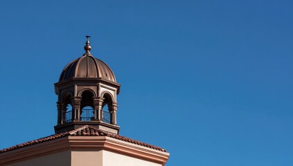 Fototapeta premium Bronze dome turret against a clear blue sky
