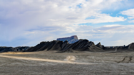 Factory Butte in Utah USA is an isolated mesa renowned for its dramatic, otherworldly landscape and desert adventurers. 