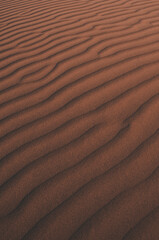 Natural designs and shapes in the sand, caused by the wind.