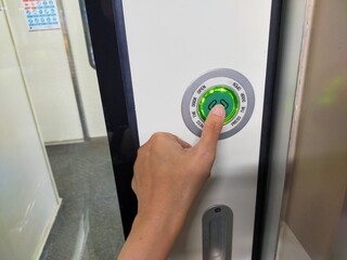 hand opening a door handle