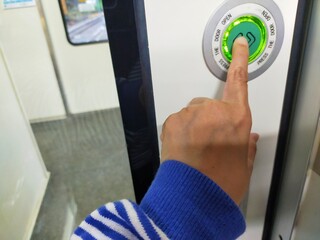 Hand touch a door opener