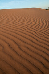 Natural designs and shapes in the sand, caused by the wind.