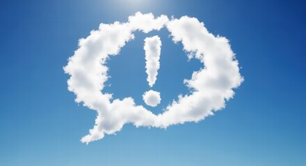 A cloud formation shaped like a speech bubble containing an exclamation mark, in a blue sky.
