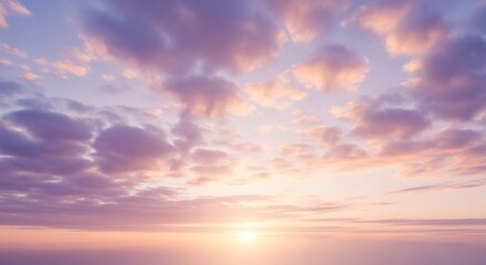Obraz premium Pastel sunset sky filled with soft clouds.