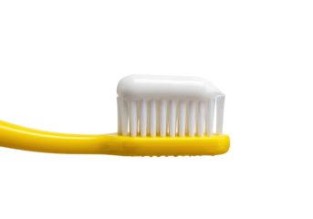 Yellow toothbrush with white toothpaste. Cut out PNG