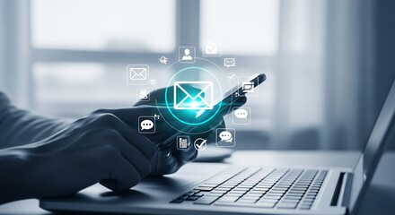 Digital Communication Technology Hand Interacting with Email Icons on Smartphone Over Laptop Keyboard for Business Workflow Management