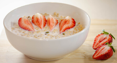 Granola with Milk and Sliced Strawberries for Breakfast,
A delicious breakfast bowl with granola, milk, and sliced strawberries, offering a mix of flavors and essential nutrients to fuel your day