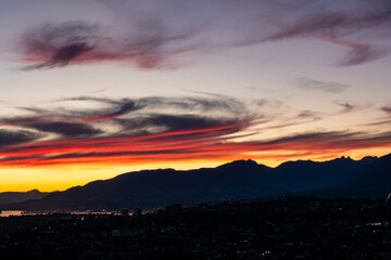 Fototapeta premium Sunset and sunrise views from Concord Brentwood Hillside East tower in Burnaby, BC, Canada