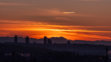 Fototapeta premium Sunset and sunrise views from Concord Brentwood Hillside East tower in Burnaby, BC, Canada