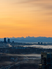Naklejka premium Sunset and sunrise views from Concord Brentwood Hillside East tower in Burnaby, BC, Canada