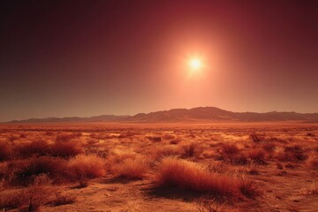 Expansive view of the Californian desert at sunset featuring rich orange hues and distant mountains under a clear sky
