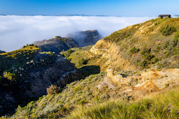 Panoramic view of the hills at River Bend Overlook Trail in Roosevelt National Park hidden in morning clouds