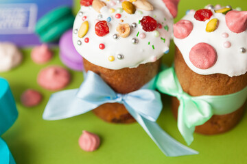 Traditional Easter cakes (kulich) with glaze, nuts, and dried fruits. Rustic still lifes with milk, eggs, willow branches, gift boxes, and festive decorations for Orthodox Easter celebration.