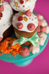 Traditional Easter cakes (kulich) with glaze, nuts, and dried fruits. Rustic still lifes with milk, eggs, willow branches, gift boxes, and festive decorations for Orthodox Easter celebration.