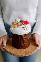 Traditional Easter cakes (kulich) with glaze, nuts, and dried fruits. Rustic still lifes with milk, eggs, willow branches, gift boxes, and festive decorations for Orthodox Easter celebration.