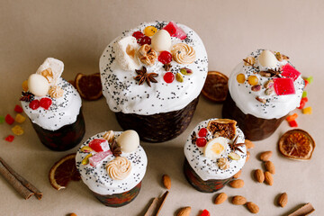 Traditional Easter cakes (kulich) with glaze, nuts, and dried fruits. Rustic still lifes with milk, eggs, willow branches, gift boxes, and festive decorations for Orthodox Easter celebration.