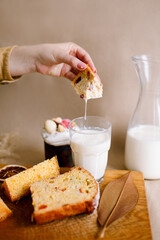 Traditional Easter cakes (kulich) with glaze, nuts, and dried fruits. Rustic still lifes with milk, eggs, willow branches, gift boxes, and festive decorations for Orthodox Easter celebration.
(198 сим