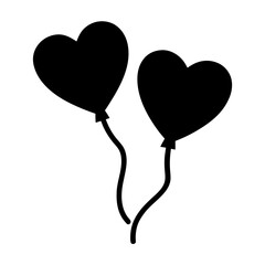 A pair of heart shaped balloons floating together in black and white