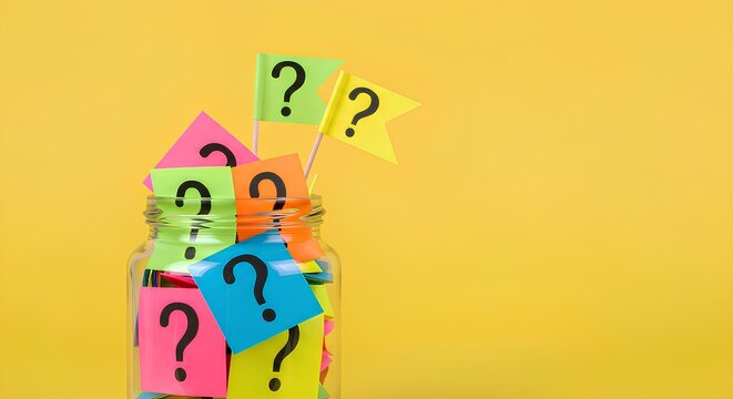 A glass jar filled with colorful sticky notes, each bearing question marks, on yellow background.