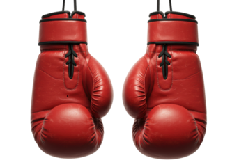 Red leather boxing gloves hanging from ropes for sport and fitness enthusiasts. Cut out PNG